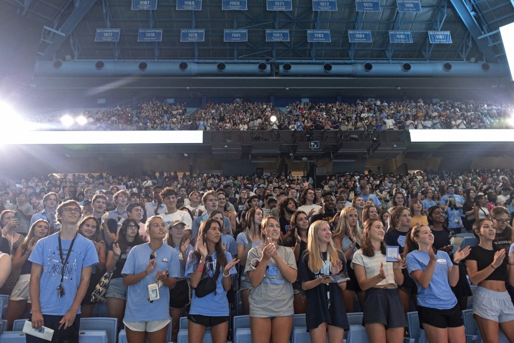 First-year Tar Heels gather in the Dean E. Smith Center for New Student Convocation the night before the fall semester begins. (Photo by Jon Gardiner)