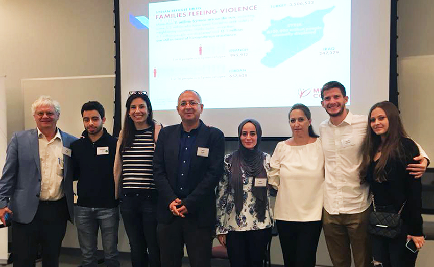 In October 2018, Cemil Aydin (fourth from left) spoke at the Syria in Transition event held by Carolina Public Humanities and the Carolina Center for the Study of the Middle East and Islamic Studies. Aydin was joined by Hiba Alzouby Pharm.D. ’21 (fourth from right) and Kamel Alachraf (second from right) as well as several Syrian refugees for a panel discussion about the global significance of the Syrian war and refugee migration.