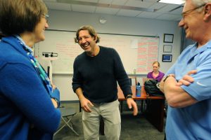 From left, Barbara Fredrickson, Claudio Battaglini and Arne Kalleberg share a laugh after class. They teach the Triple I course, “Health and Happiness.” (photo by Donn Young)